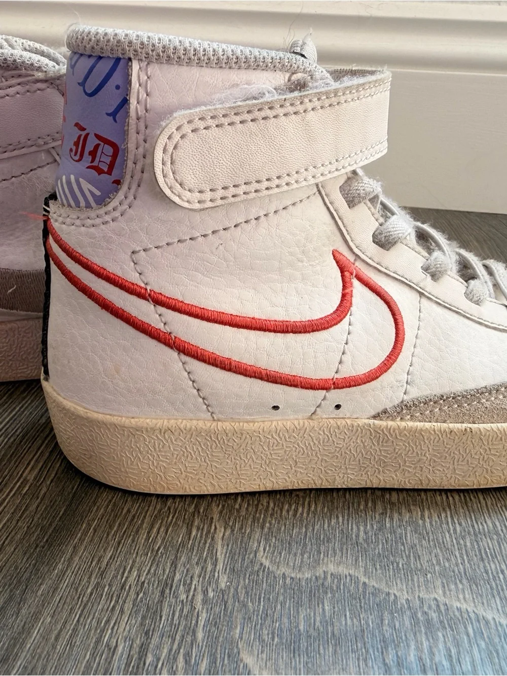 Nike Kids White High-Top Sneakers with Coral Swoosh Accent